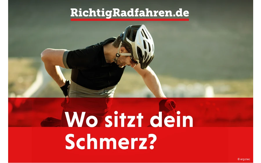 Radfahrer mit Rückenschmerzen fasst sich an den Rücken